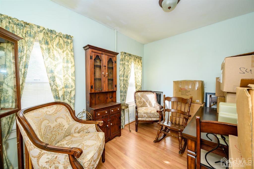 105 New Market Road Dunellen, NJ 08812 - Photo 9 of 39 a view of a workspace with furniture and a window