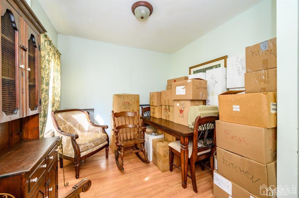 105 New Market Road Dunellen, NJ 08812 - Photo 10 of 39 a bedroom with furniture and a window