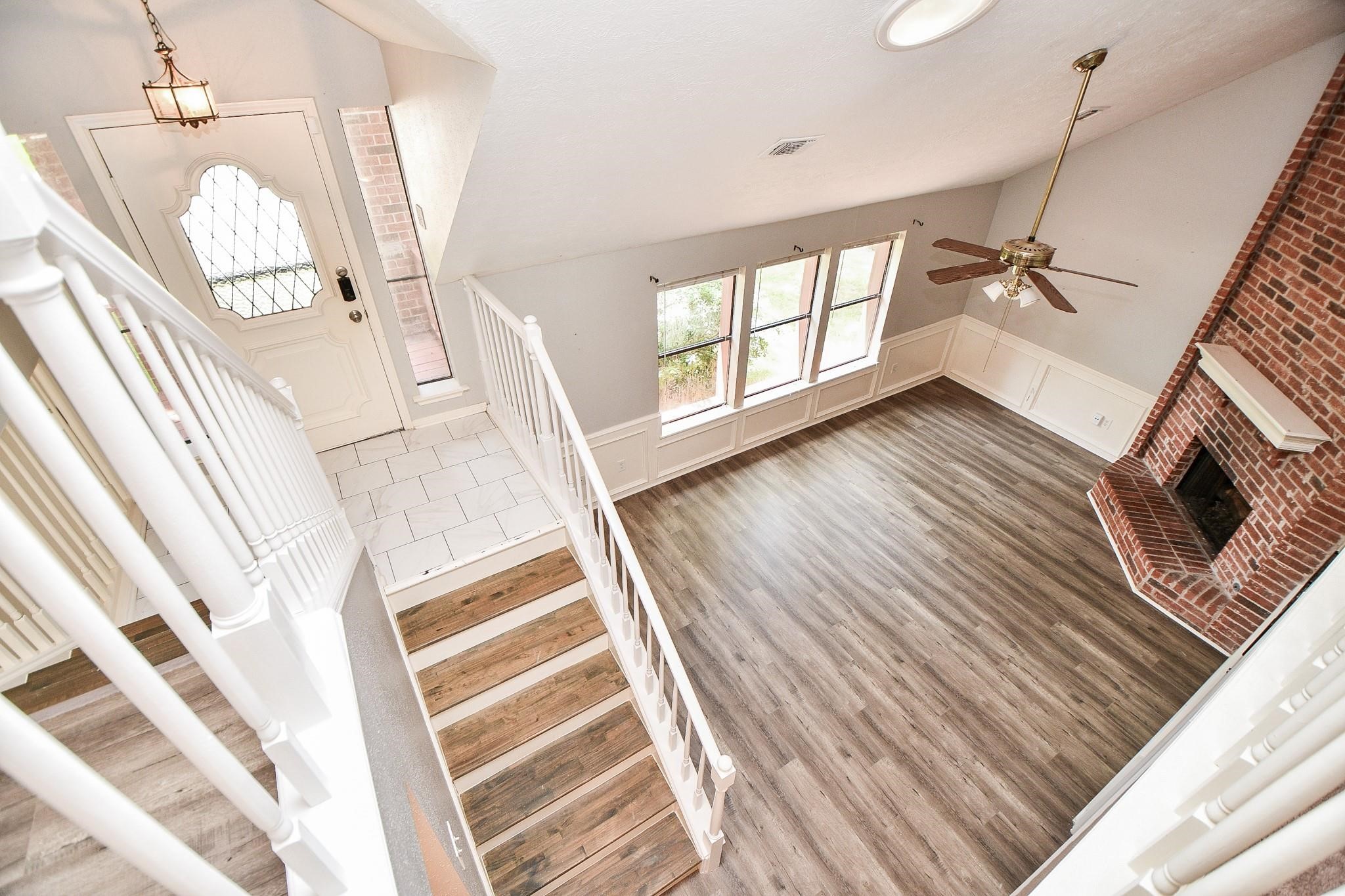 2331 Wren Meadow Road Richmond, TX 77406 - Photo 24 of 37 Entering from the front door, you go directly upstairs or down! Fascinating and Beautiful design!
