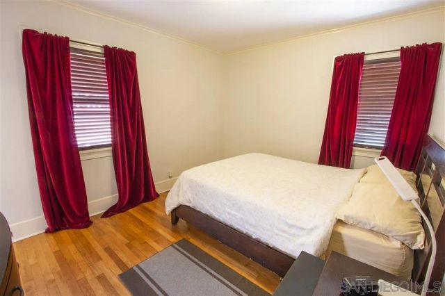 a bathroom with a sink a toilet and a window