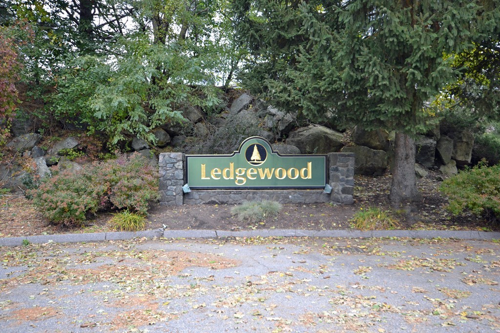 9 Ledgewood Way, Unit 2 Peabody, MA 01960 - Photo 1 of 22 a view of a sign board with large trees
