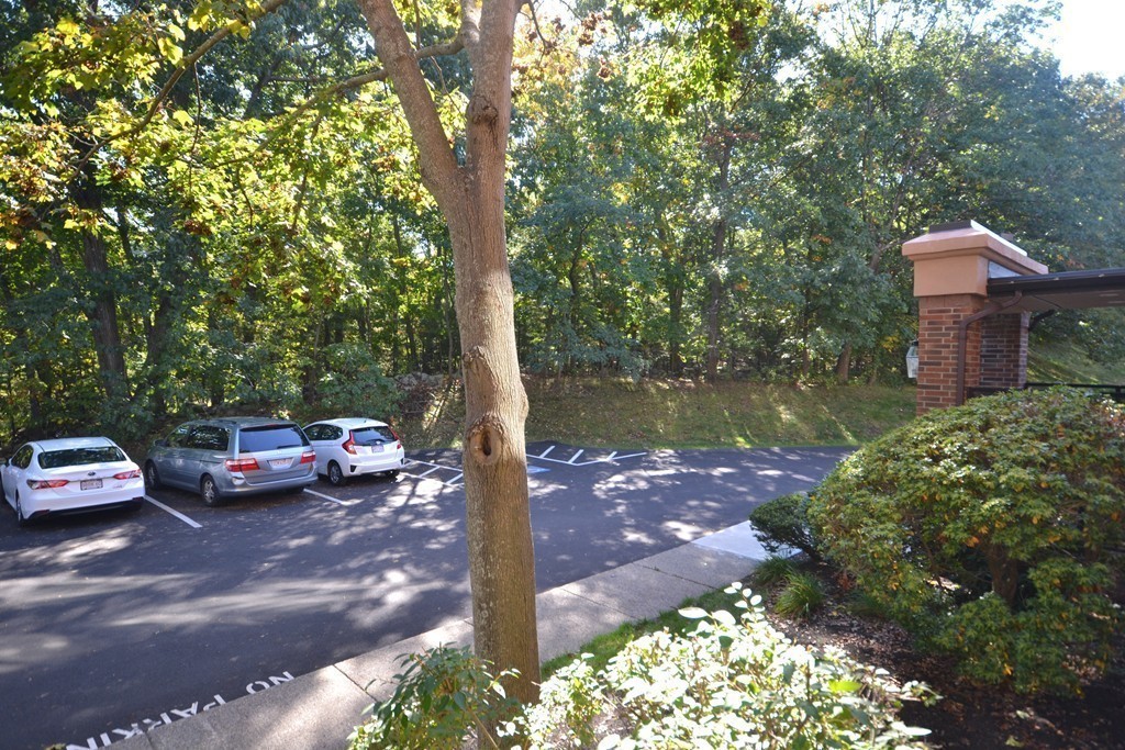 9 Ledgewood Way, Unit 2 Peabody, MA 01960 - Photo 14 of 22 a view of a street with cars parked