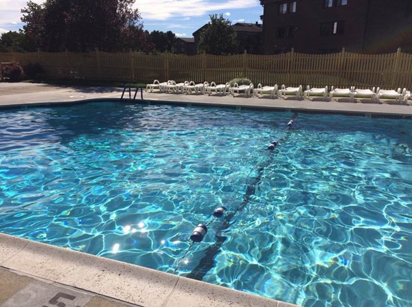 9 Ledgewood Way, Unit 2 Peabody, MA 01960 - Photo 20 of 22 a view of a lake from a yard