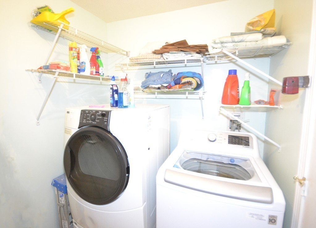 9 Ledgewood Way, Unit 2 Peabody, MA 01960 - Photo 9 of 22 a utility room with dryer and washer