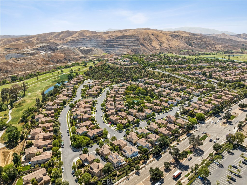 4155 Windspring Street Corona, CA 92883 - Photo 38 of 38 an aerial view of residential houses with outdoor space and trees