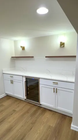 a kitchen with stainless steel appliances granite countertop a sink and a stove