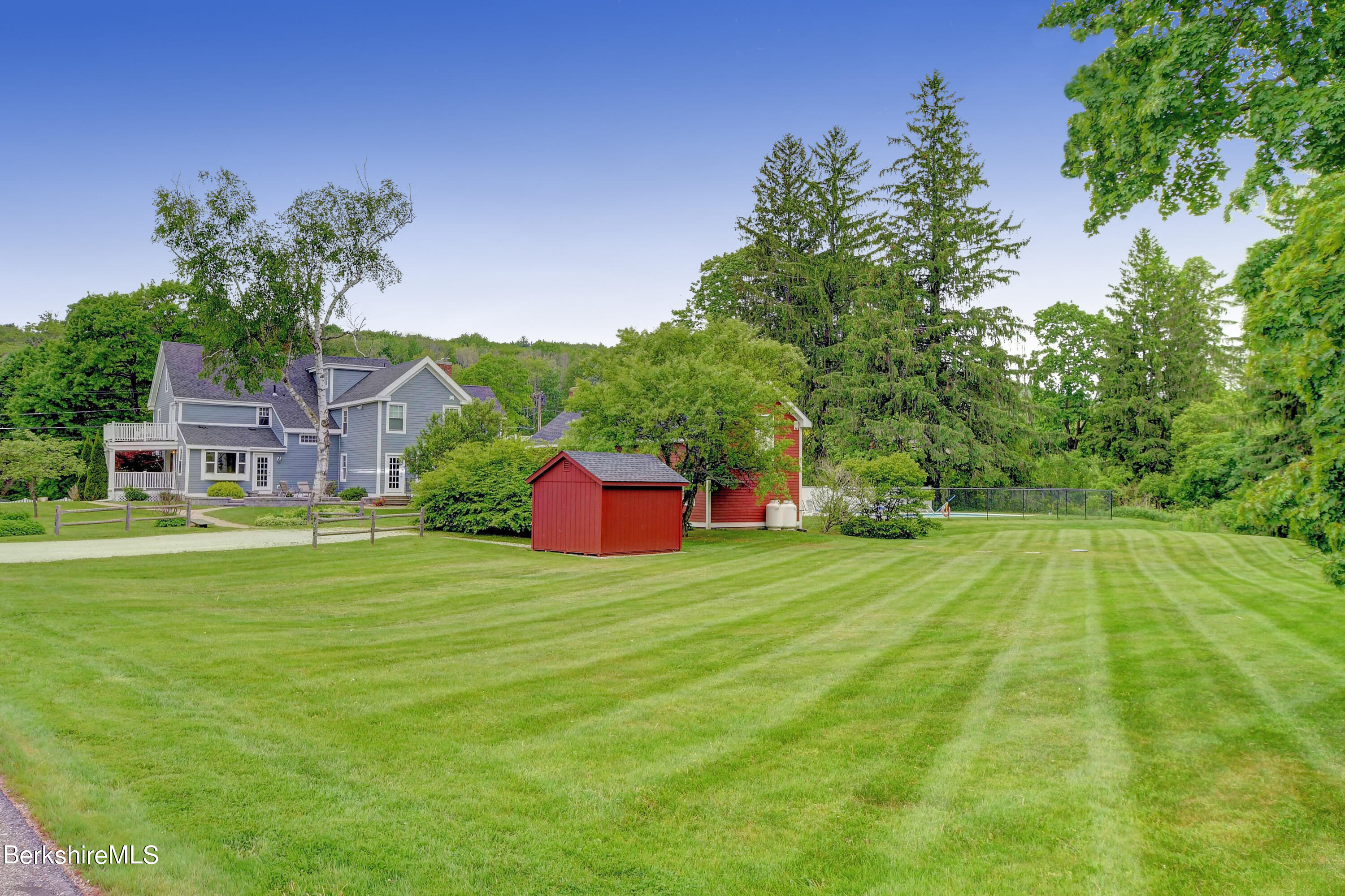 1 Devon Road Stockbridge, MA 01262 - Photo 50 of 58 a front view of a house with a yard