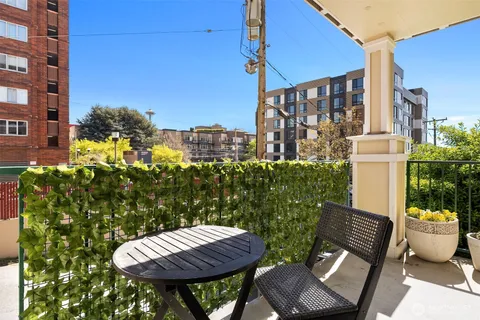 a view of a chairs and table in the patio