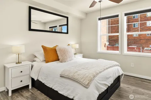a bedroom with a bed and a window