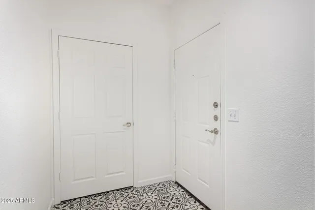 a view of staircase with white walls