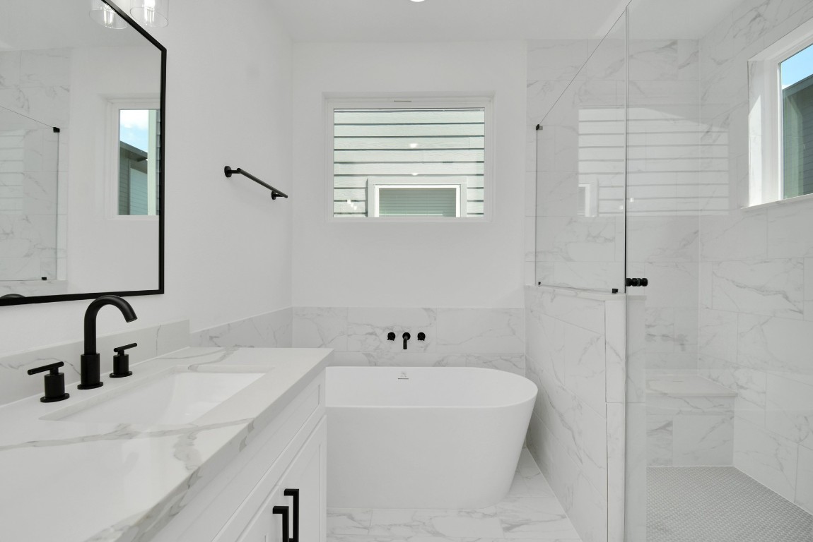 3036 Live Oak Street Houston, TX 77004 - Photo 25 of 35 a bathroom with a sink a window and a mirror