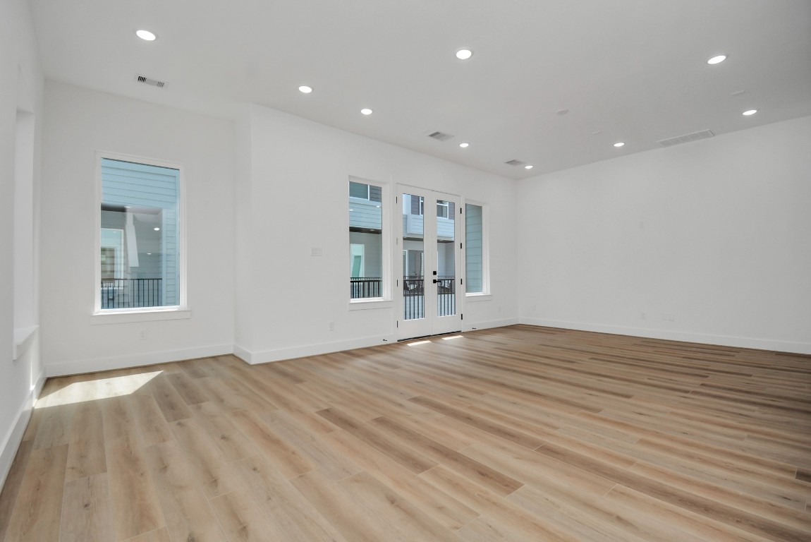 3036 Live Oak Street Houston, TX 77004 - Photo 10 of 35 a view of empty room with wooden floor and fan