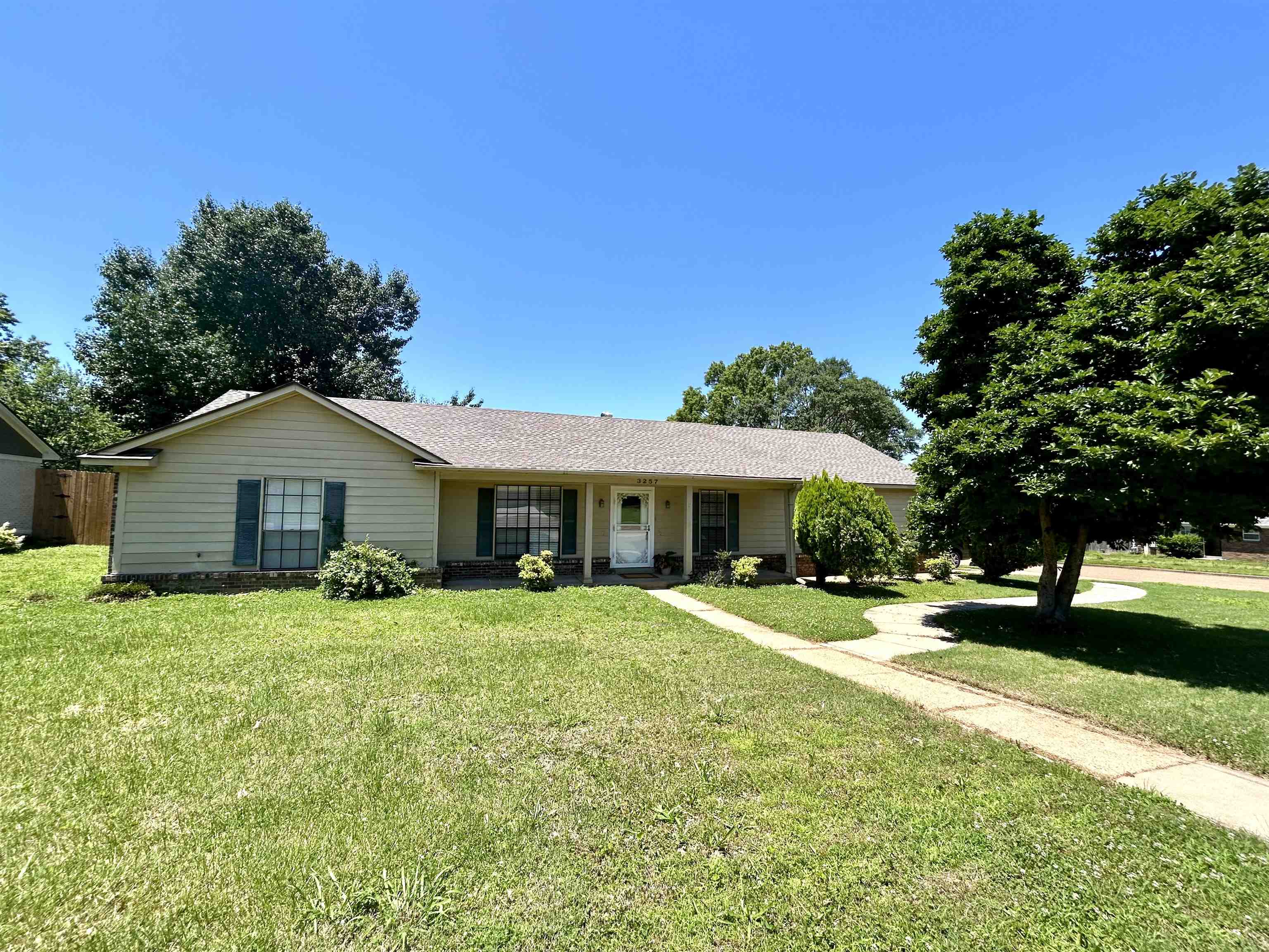 3257 Altruria Road Bartlett, TN 38134 - Photo 1 of 27 Ranch-style house with a front lawn and roof with shingles