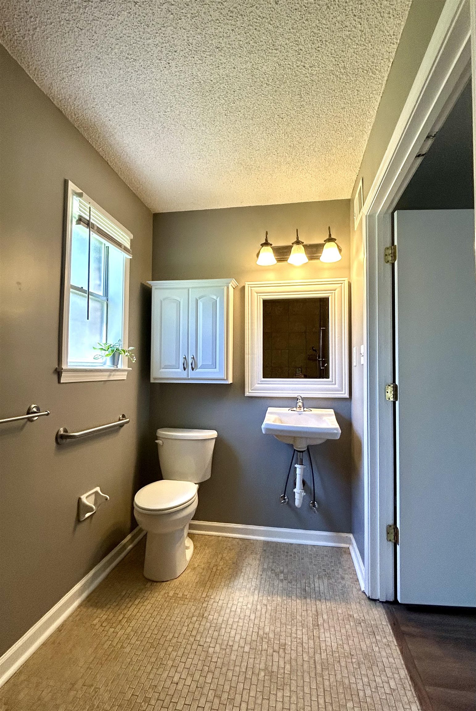 3257 Altruria Road Bartlett, TN 38134 - Photo 16 of 27 Bathroom featuring toilet, a textured ceiling, and baseboards