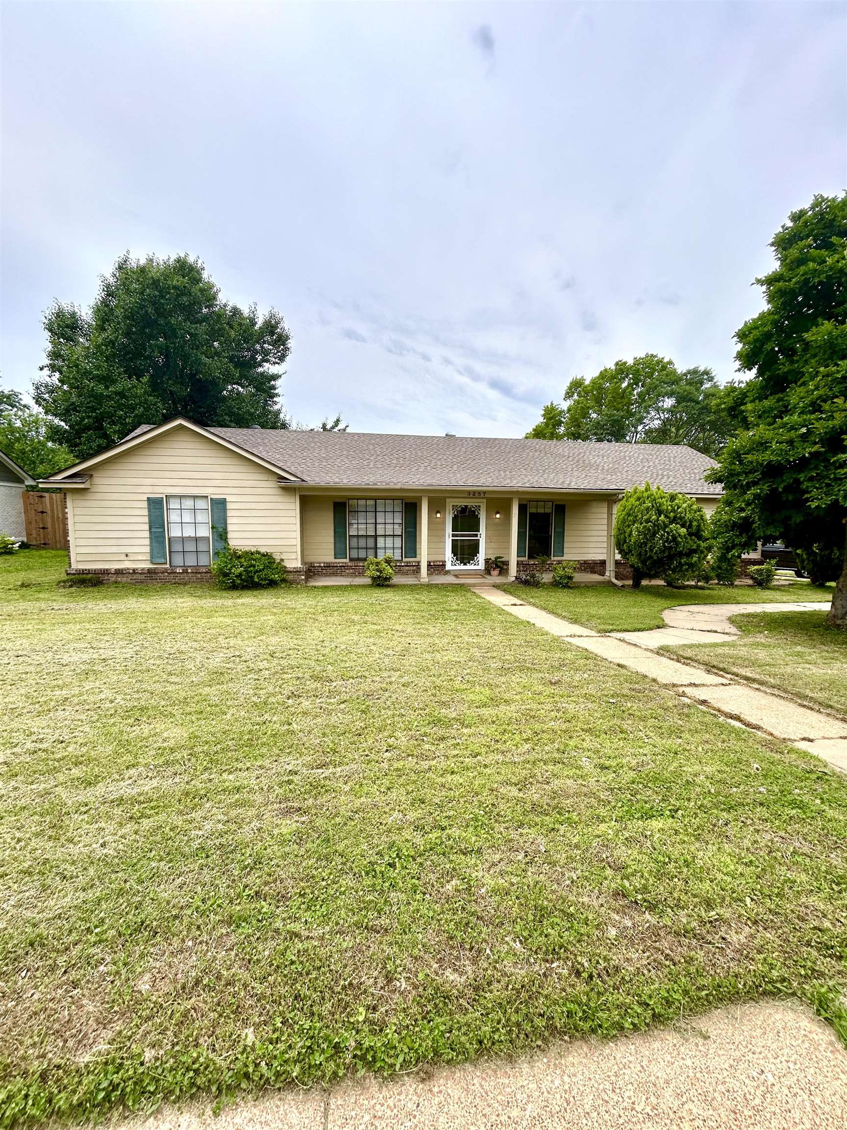 3257 Altruria Road Bartlett, TN 38134 - Photo 2 of 27 Ranch-style house featuring a front yard and a shingled roof