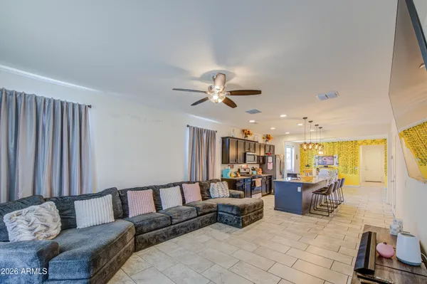a living room with furniture and a large window
