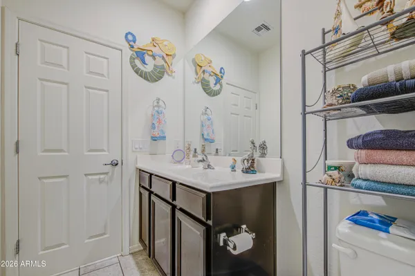 a bathroom with a sink and mirror