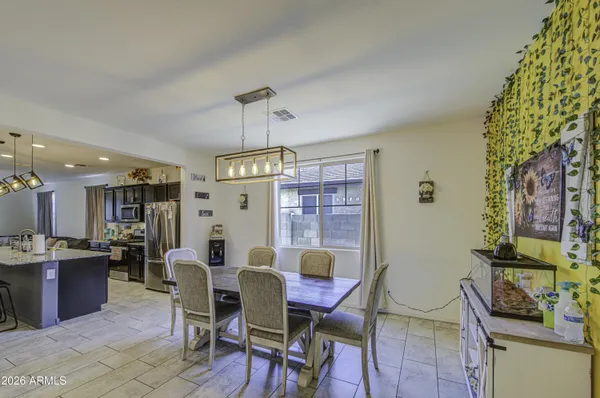 a view of a dining room with furniture