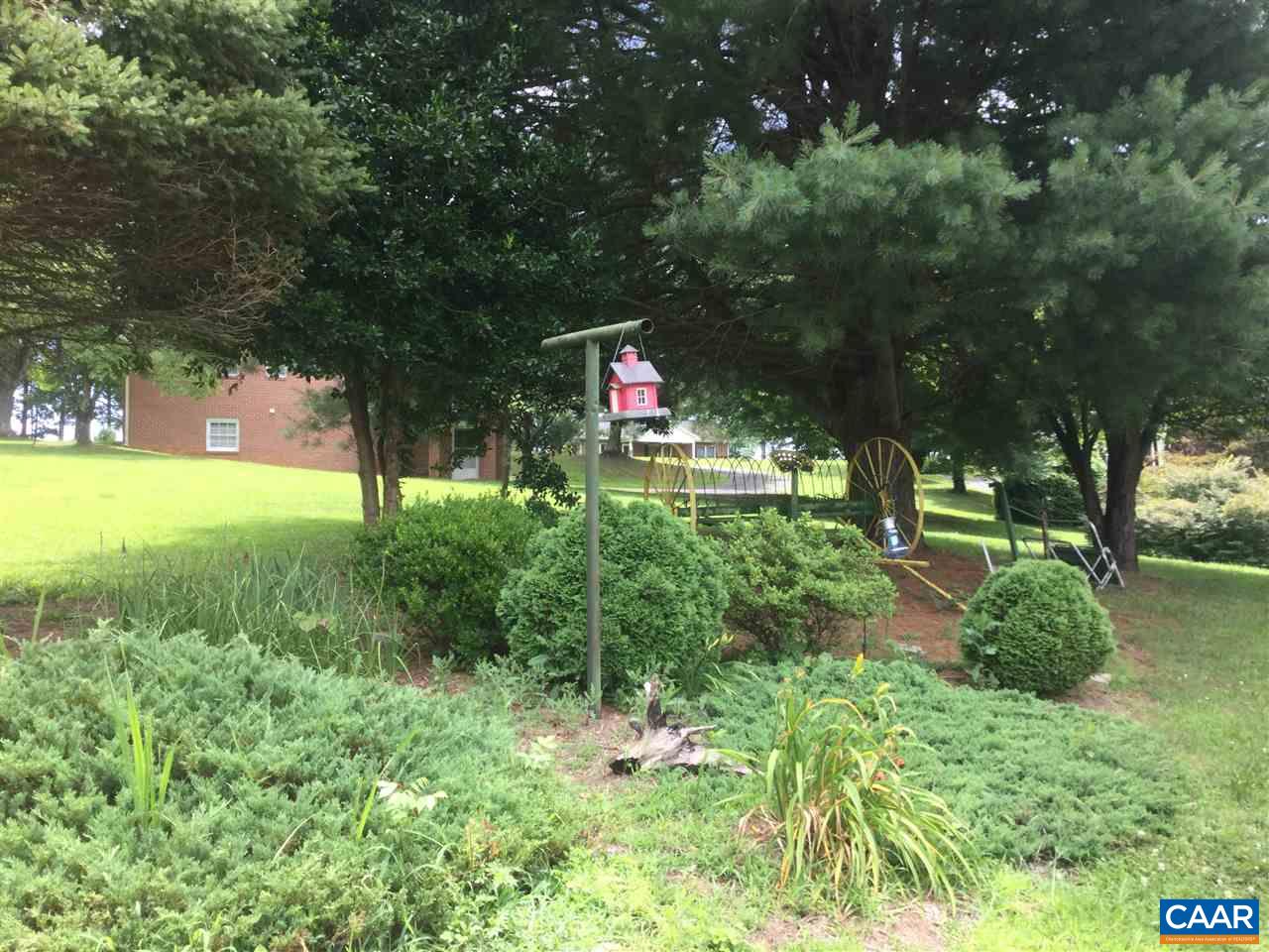 374 Pine Bluff Road Ruckersville, VA 22968 - Photo 11 of 24 a backyard of a house with lots of green space and fountain