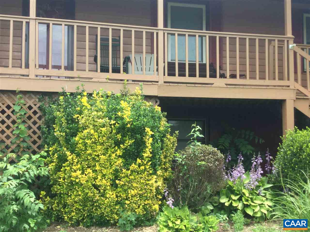 374 Pine Bluff Road Ruckersville, VA 22968 - Photo 18 of 24 a view of a house with a flower garden