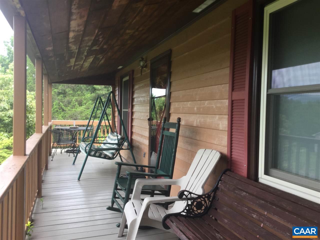 374 Pine Bluff Road Ruckersville, VA 22968 - Photo 19 of 24 a view of a porch with furniture and wooden floor