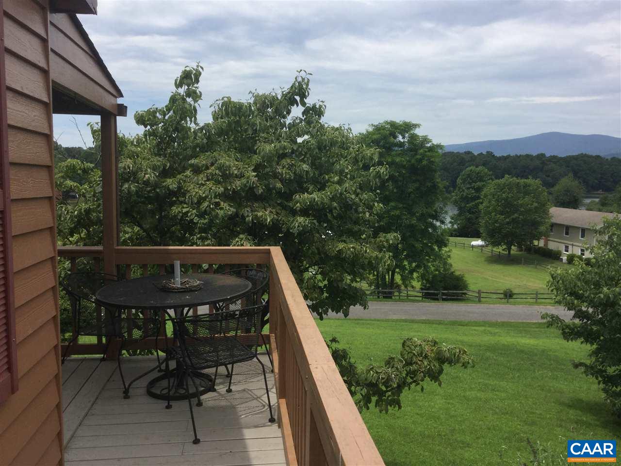 374 Pine Bluff Road Ruckersville, VA 22968 - Photo 21 of 24 a view of balcony with two chairs and a table