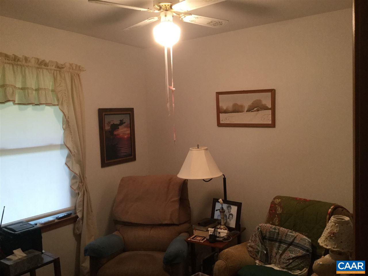 374 Pine Bluff Road Ruckersville, VA 22968 - Photo 7 of 24 a living room with furniture and a lamp