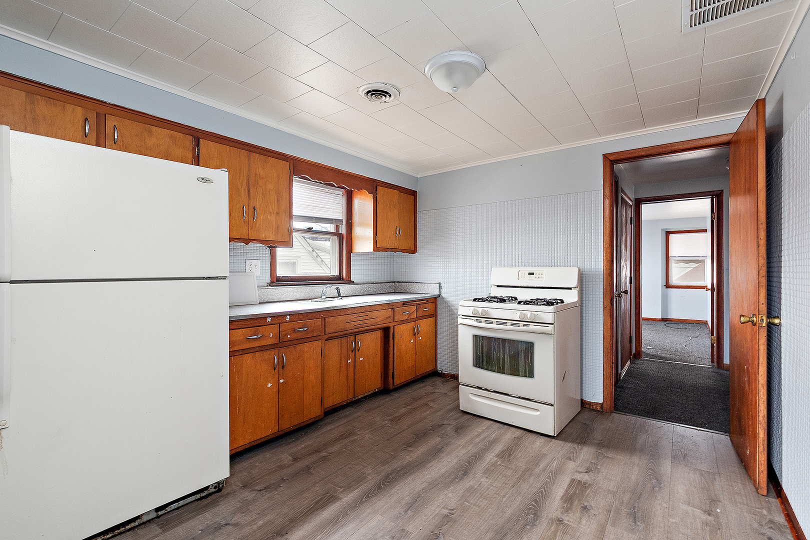 14627 South Short Street Posen, IL 60469 - Photo 15 of 31 a kitchen with stainless steel appliances granite countertop a refrigerator a sink dishwasher a stove and a refrigerator with wooden floor