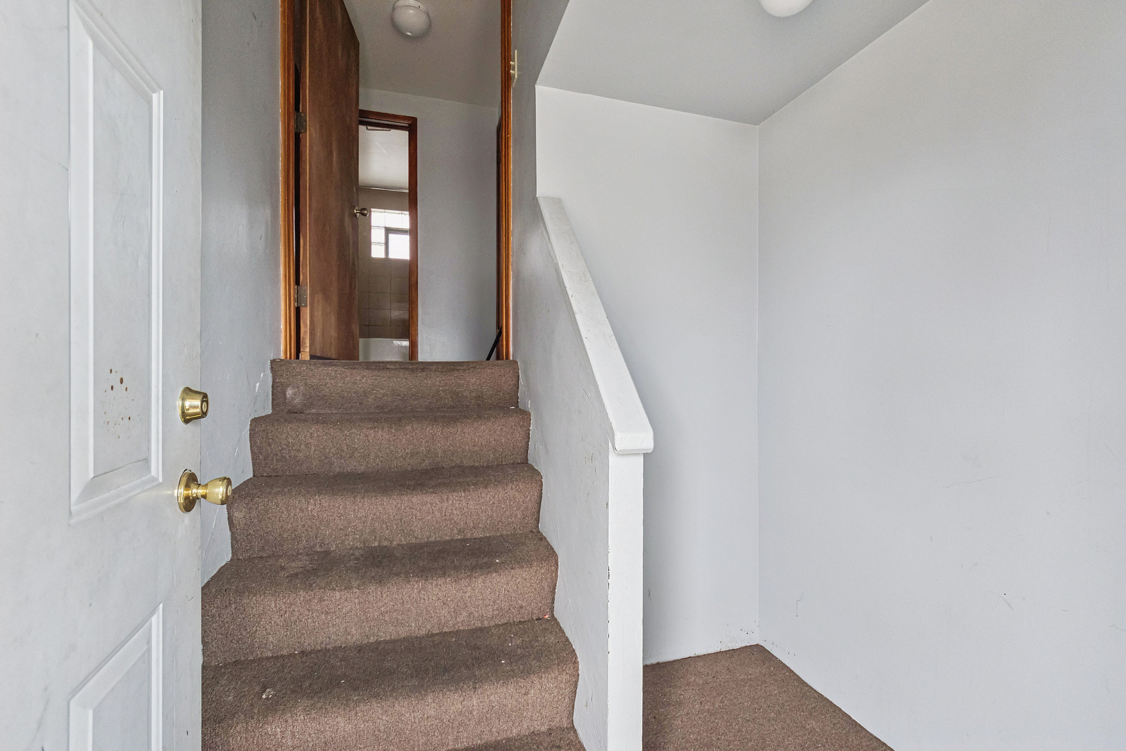 14627 South Short Street Posen, IL 60469 - Photo 20 of 31 a view of staircase with white walls and windows