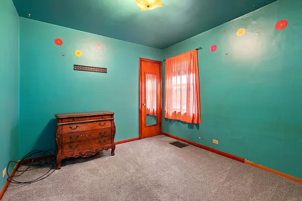 a room with window and a projector screen