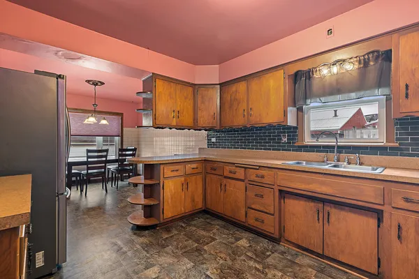 a kitchen with lots of counter top space and dining table