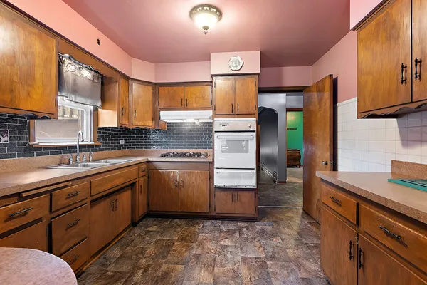 a kitchen with sink cabinets and window