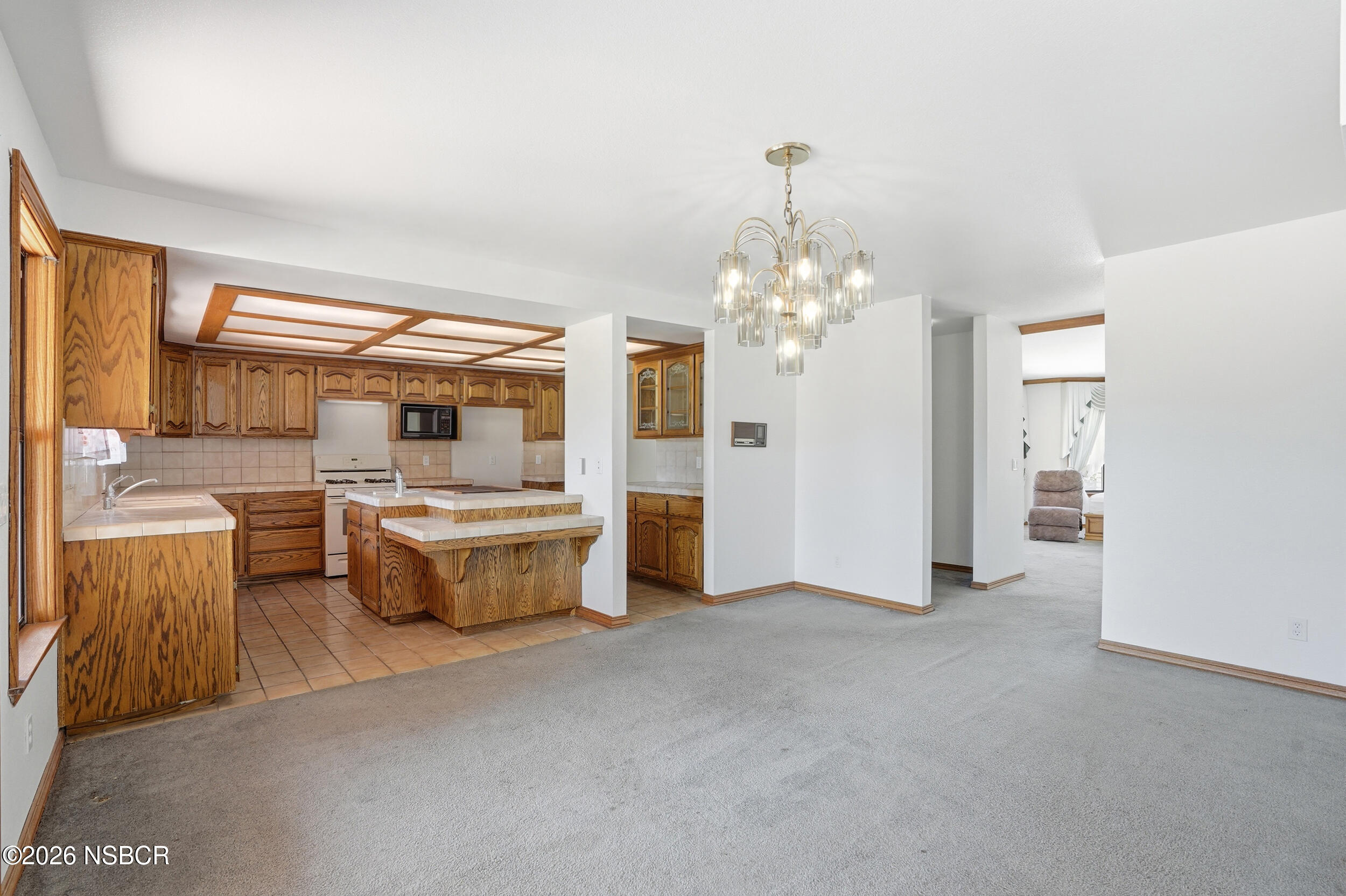 140 East Rice Ranch Road Santa Maria, CA 93455 - Photo 12 of 44 a very nice looking room with a large window and chandelier