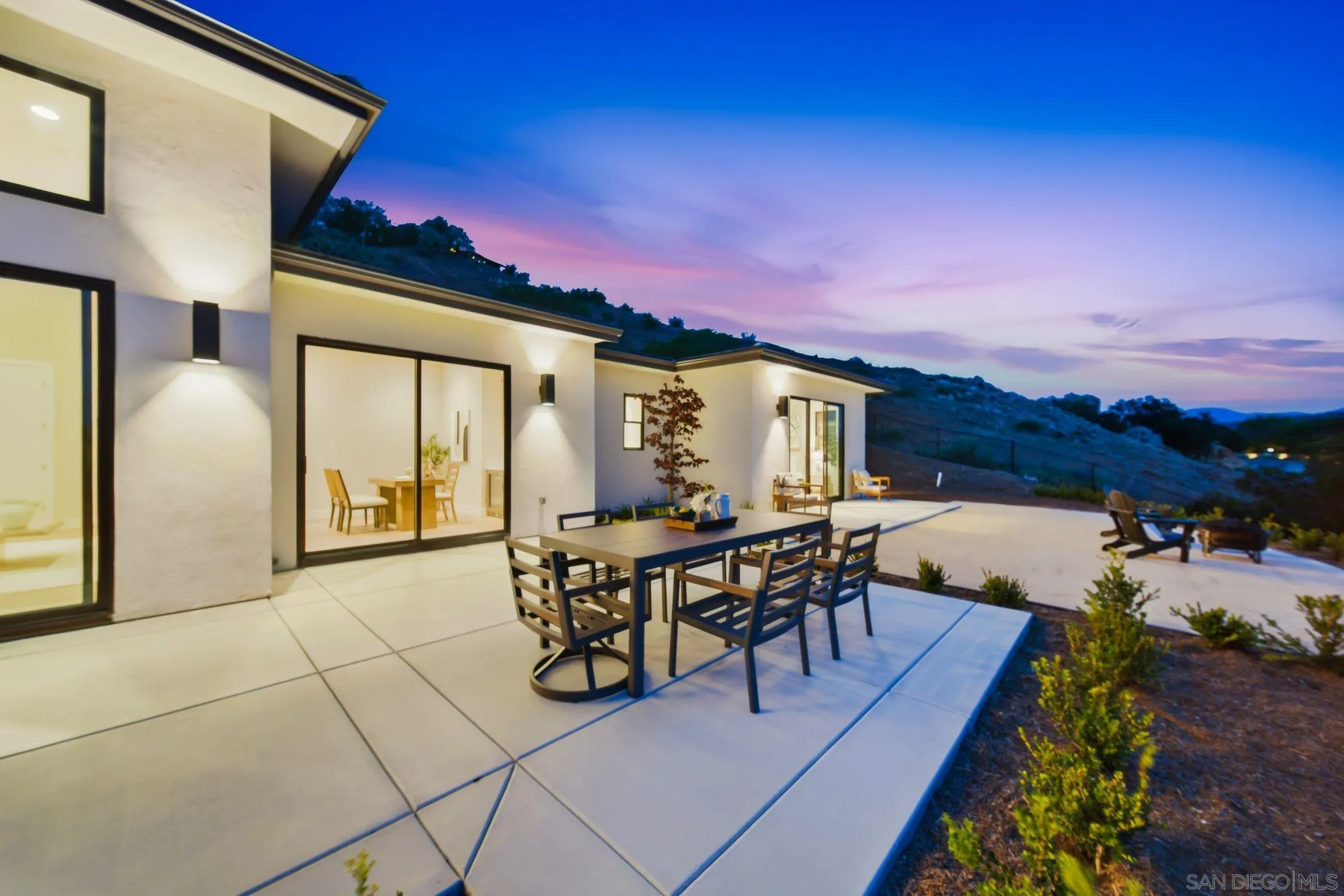 3916 Citrus Drive Fallbrook, CA 92028 - Photo 69 of 72 a view of a patio with dining table and chairs with a barbeque grill and plants