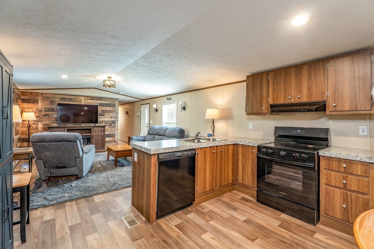 24 Co Rte 10/2 Franklin, WV 26807 - Photo 24 of 66 a kitchen with stainless steel appliances granite countertop a stove and a sink