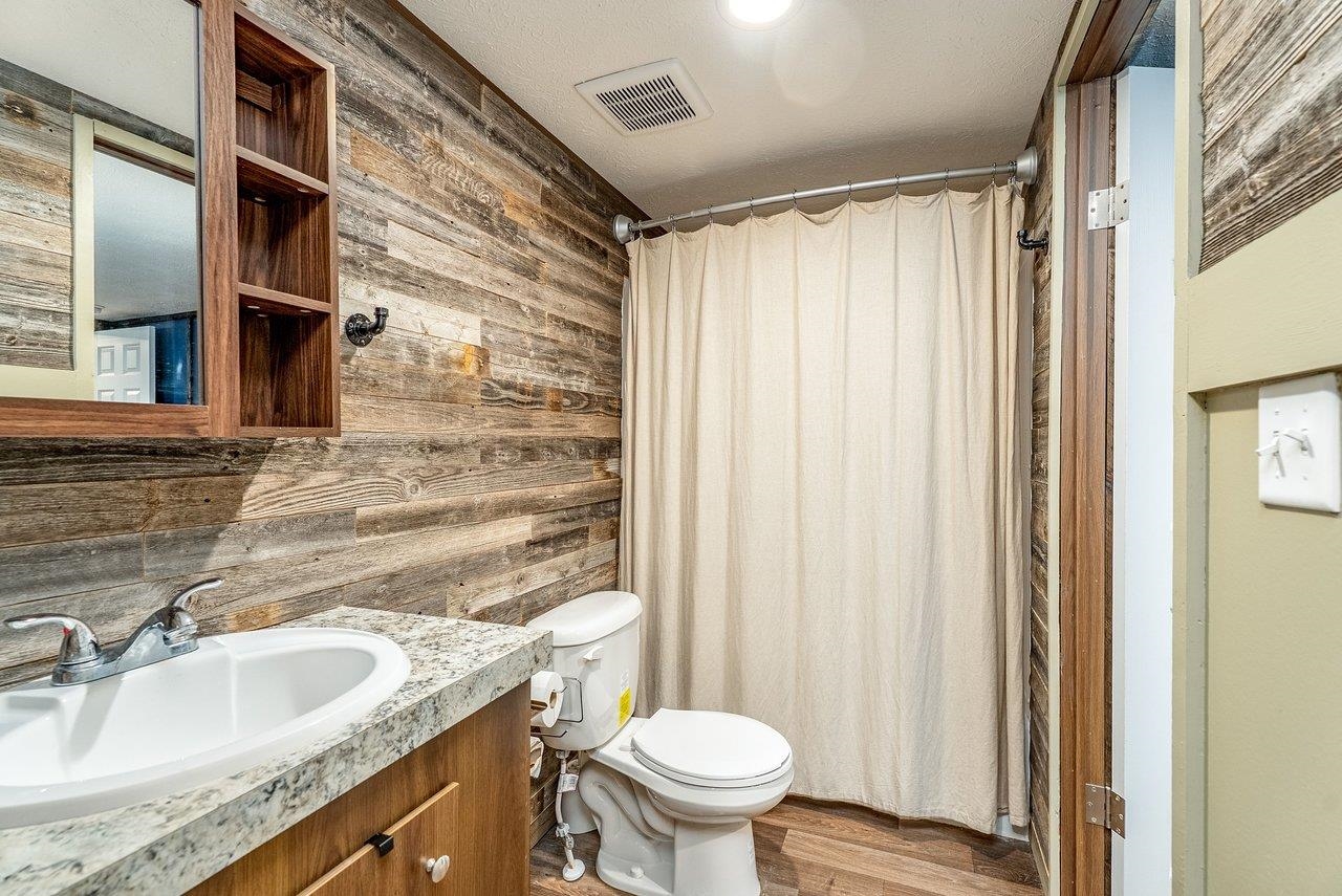 24 Co Rte 10/2 Franklin, WV 26807 - Photo 34 of 66 a bathroom with a granite countertop sink toilet and shower