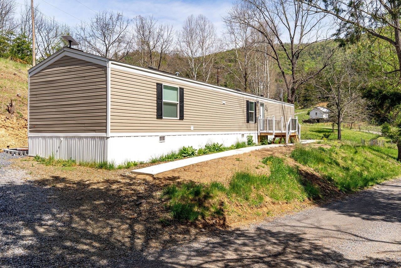 24 Co Rte 10/2 Franklin, WV 26807 - Photo 50 of 66 a backyard of a house with large trees and wooden fence