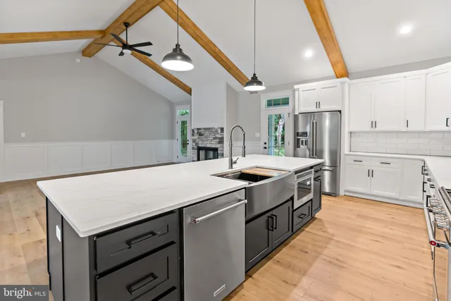 a kitchen with a sink and cabinets