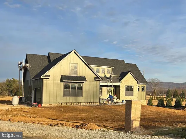a view of a house next to a yard