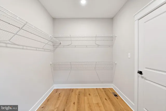 a view of a room with racks on the wall