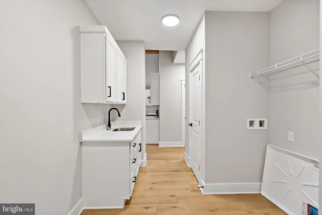 a bathroom with a sink toilet and mirror