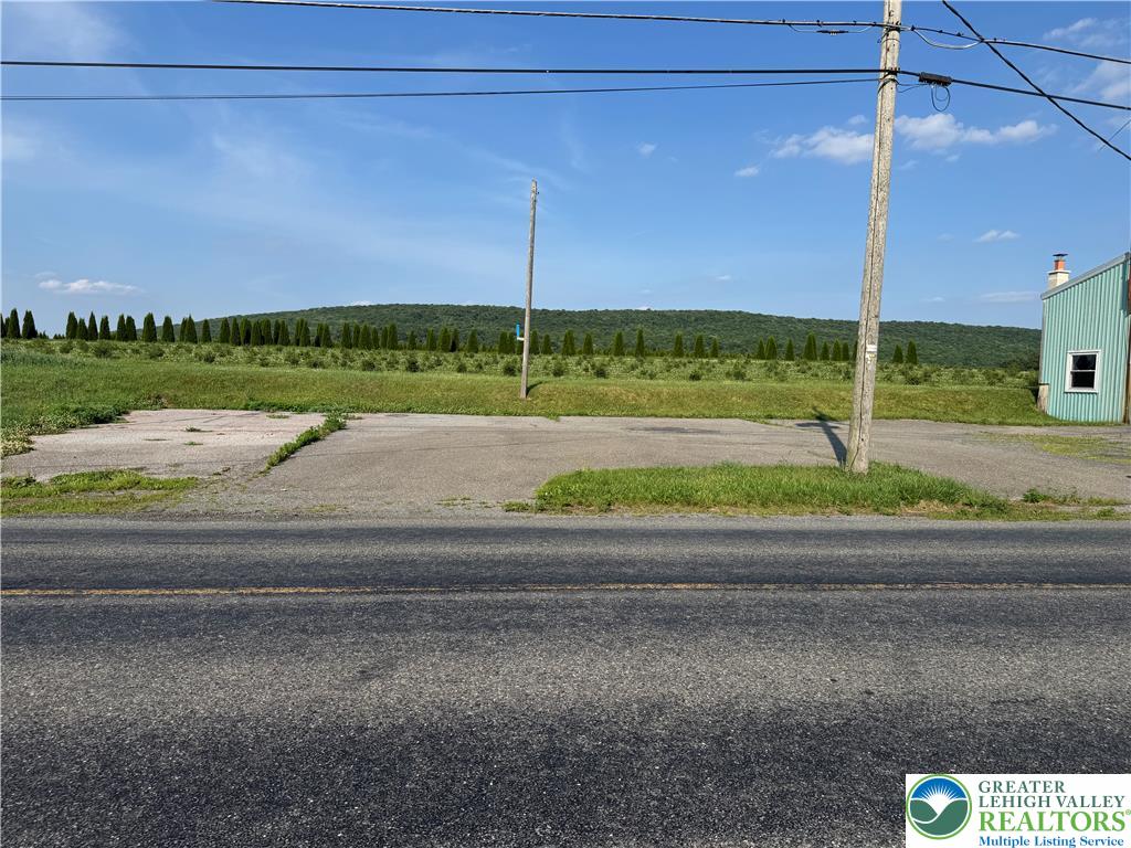 868 Catawissa Road Tamaqua, PA 18252 - Photo 16 of 67 A spacious, open parcel offers potential for development, bordered by distant rolling hills.