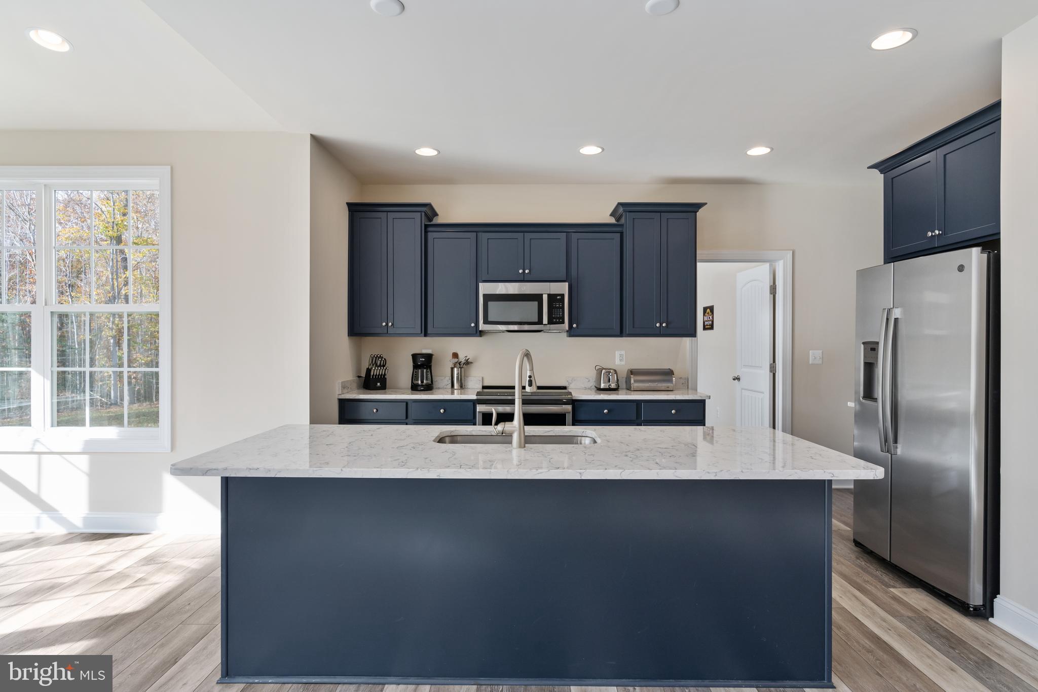 214 Kellan Drive Fredericksburg, VA 22406 - Photo 5 of 81 Gourmet kitchen with stunning navy cabinets
