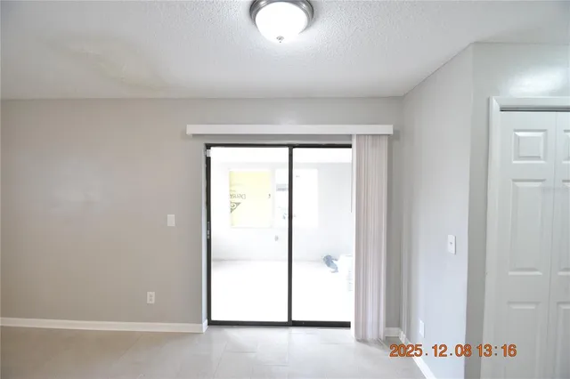a kitchen with granite countertop white cabinets and a sink
