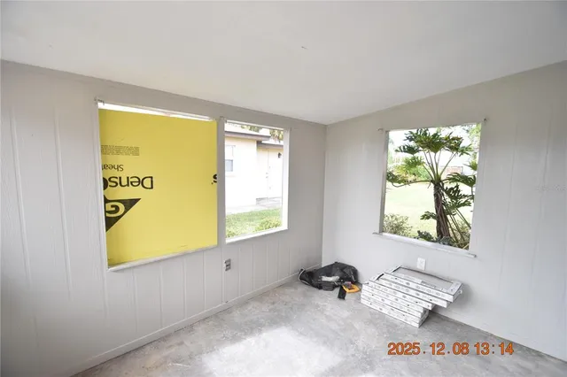 a view of an empty room and window