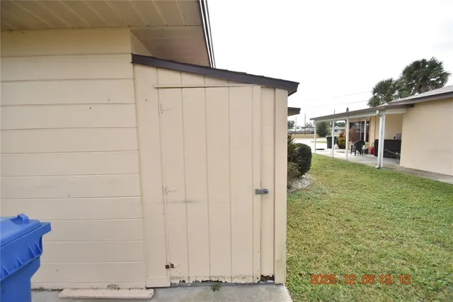 a front view of a house with glass windows and table