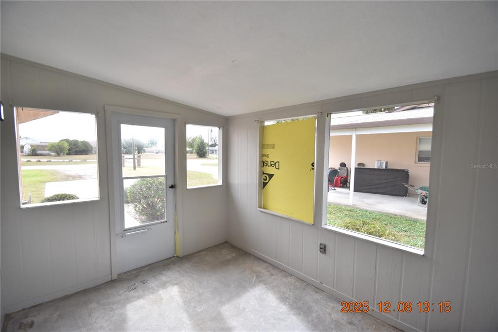 705 2nd Avenue Northwest, Unit B Ruskin, FL 33570 - Photo 3 of 29 a view of an empty room and window