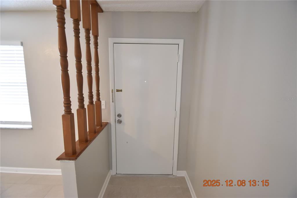 705 2nd Avenue Northwest, Unit B Ruskin, FL 33570 - Photo 6 of 29 a view of a hallway with staircase