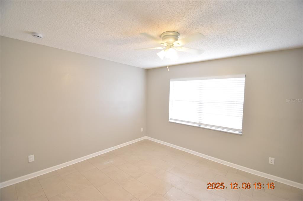 705 2nd Avenue Northwest, Unit B Ruskin, FL 33570 - Photo 10 of 29 an empty room with a window