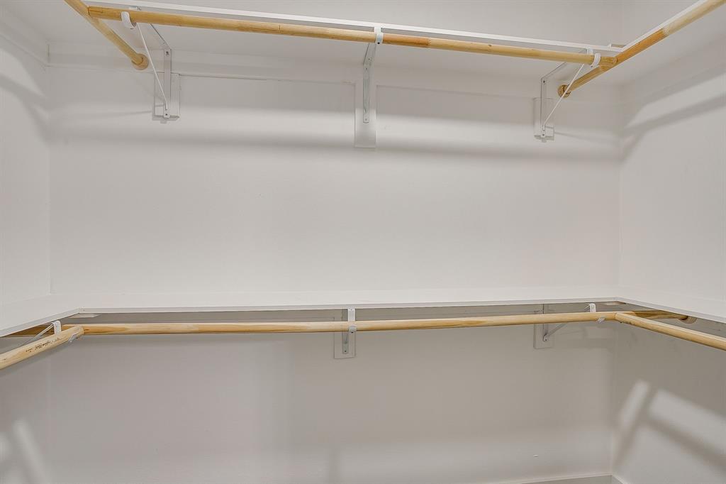 122 Kentucky Street Walnut Springs, TX 76690 - Photo 12 of 18 a view of a room with racks on the wall